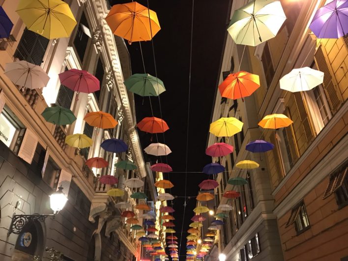 Colored umbrellas hanging in Genoa in via XXV Aprile